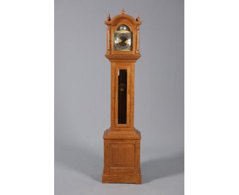 ATTRIBUTED TO SID POLLARD OF THIRSKA YORKSHIRE OAK GRANDMOTHER CLOCK, the case with arch-top hood and glazed trunk door, dial