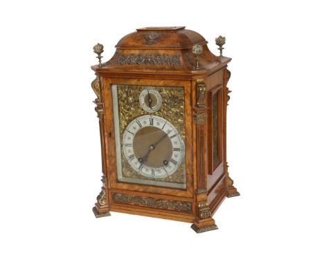 A HANDSOME WALNUT CHIMING BRACKET CLOCK, RETAILED BY THOMPSON, SCARBOROUGH, the case with brass flaming finials and canted co