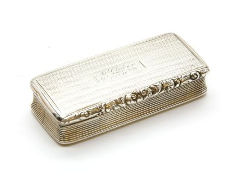 A Regency silver and silver gilt interior rectangular snuff box, by Nathaniel Mills, having scroll chased rim, engine turned 