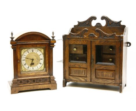 A mantle clock, 36cm high and a smokers cabinet, 42cm wide