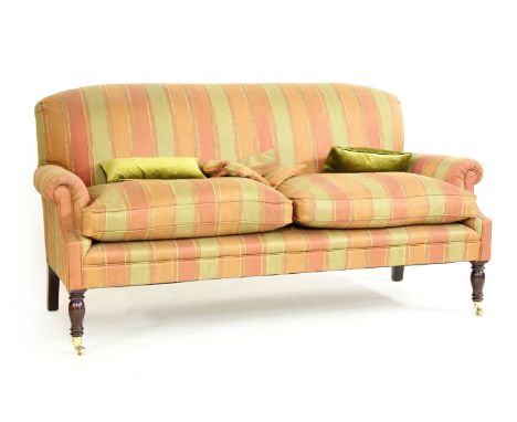 A George Smith two seater sofa, having stuff over back and cushioned seats, in striped fabric, on turned supports descending 