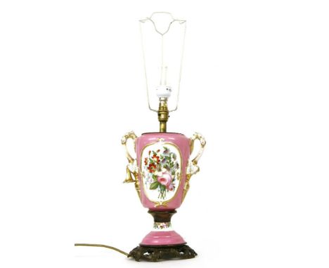 A twin handled vase form porcelain table lamp, the pink ground with landscape decorated reserve, 44cm high