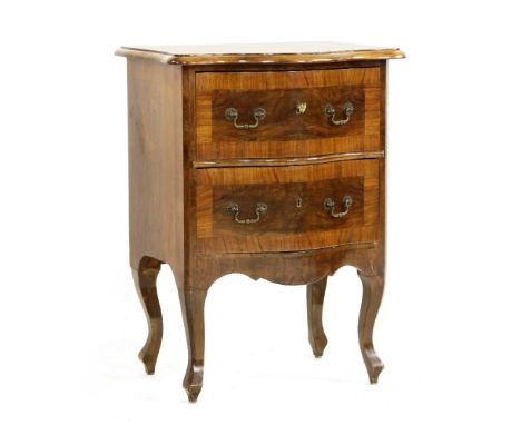 A Louis XV design walnut petit commode, the cross banded serpentine top above three drawers on cabriole supports, 54cm wide x