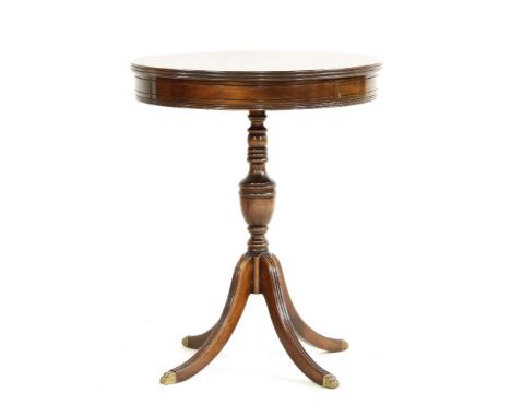 A mahogany lamp table, the circular top on turned column and tripod base, 55cm diameter x 72cm high, together with a black la
