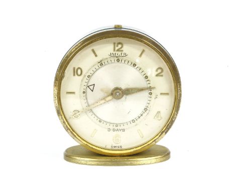 A Jaeger mechanical alarm clock, c.1960, 45mm diameter, with gilt metal blue case, no.51