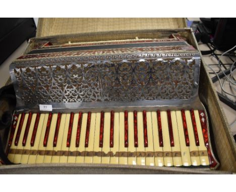 A Scandallio traditional piano accordion in case