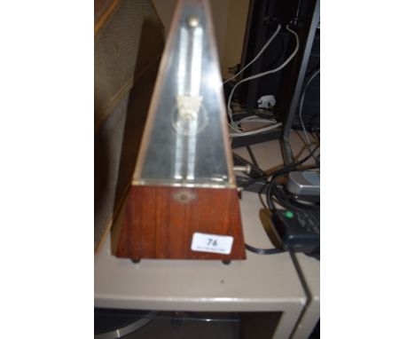 A wooden cased metronome