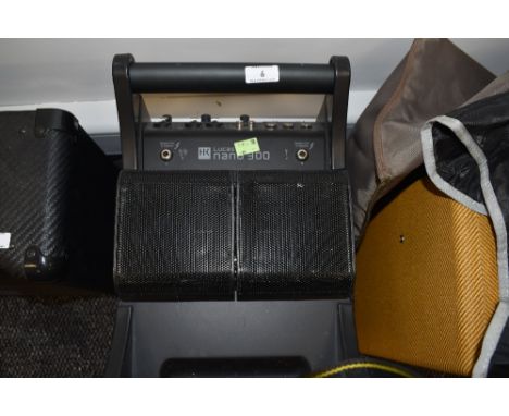 A HK Lucas Nano 300 combo amp system, no speaker stands