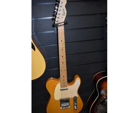 A Fender Squier Telecaster, with padded gig bag