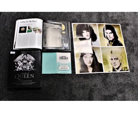 A book of  Qujeen interest with inserts and facsimile gig posters , flyers and more - a really nice item on offer here 