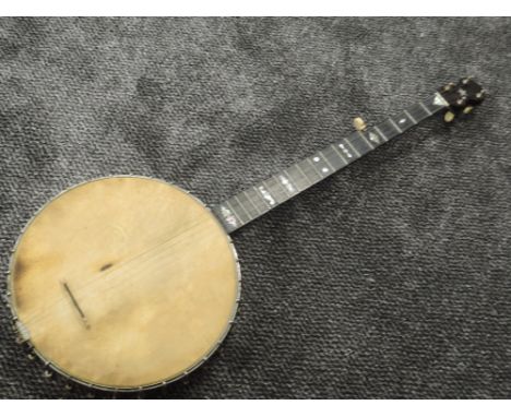An early 20th Century 5 string banjo, tension post stamped A C Fairbanks and Co, MassLOOKS AND SOUNDS GOOD, DISCOLOURATION TO
