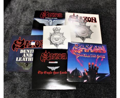 A lot of ten vinyl albums by Saxon - including the iron on patch ! Heavy Metal interestVERY GOOD CONDITION 