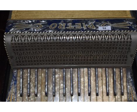A vintage Pietro piano accordion in caseBellows seem sound. one key loose, generally tired, case battered