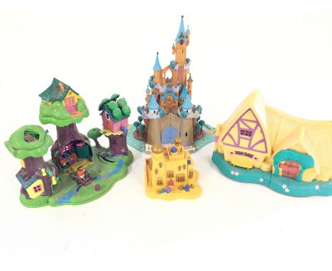 A box containing Disney Polly Pockets. Winnie the Pooh 100 acres. Cinderella Castle. Aladdinâ€™s house. snow Whites house.