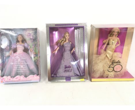 A collection of three boxed Barbie dolls featuring The Fairy Queen..Barbie 2003..Barbie 50. (3)