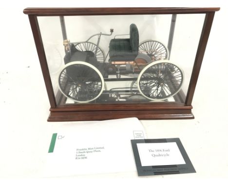 A Boxed Franklin Mint 1896 Ford Quadricycle with Display Case 1:6 Scale.(2).