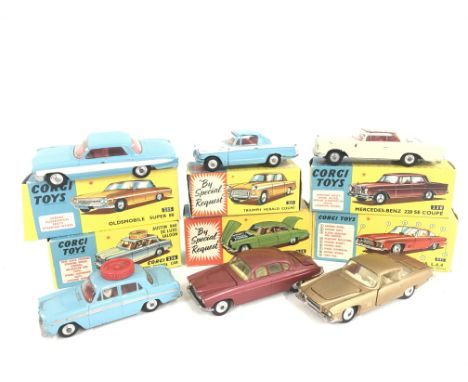 6 Boxed Corgi Vehicles. A Oldsmobile Super 88 #235. A Triumph Herald Coupe #231. A Mercedes-Benz 220 SE Coupe #230. A Austin 
