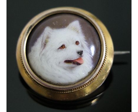 A Victorian gold mounted brooch with enamel dog portrait signed 'W.B. Ford' and dated 1879, diam. 21cm, gross wt. 3.2g.  Cond