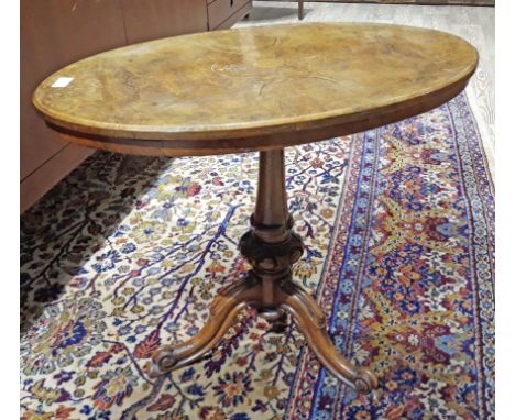 Small oval inlaid Victorian burr wlanut table with carved tripod base. W73cm 