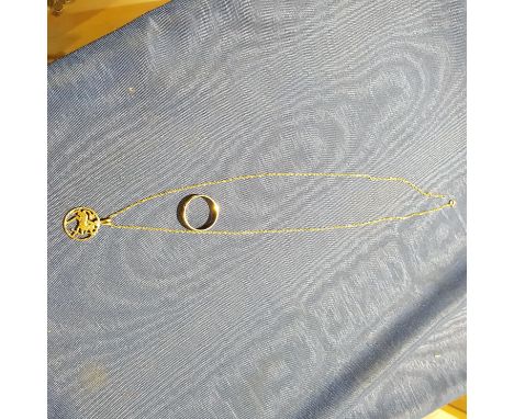 A halmarked 9ct gold pendant and chain together with a 9ct gold ring, wt. 4.6g.  