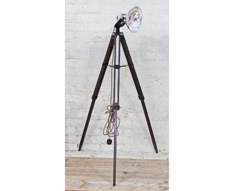 An industrial style aluminium spot light with adjustable tripod stand.  