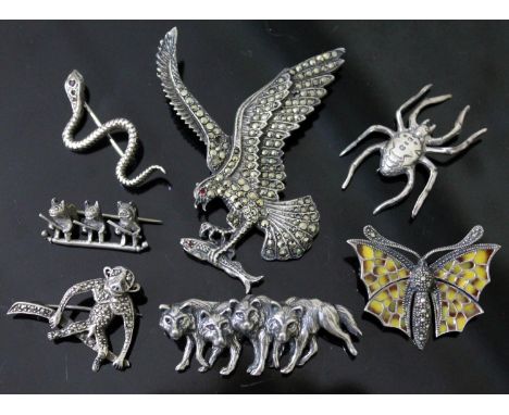 A group of seven silver/white metal vintage animal brooches comprising a wolf pack brooch marked 'SC Sterling', a contemporar