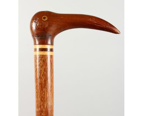 A PITCAIRN ISLAND WALKING STICK, with birds head handle. 36ins long.