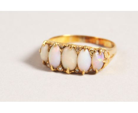 A GOOD FIVE-STONE OPAL RING.