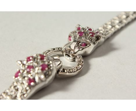 A SILVER, MARCASITE AND RUBY PANTHER BRACELET.