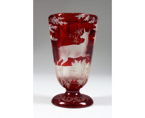A 19TH CENTURY BOHEMIAN RUBY GLASS GOBLET, engraved with a deer in a landscape. 5ins high.