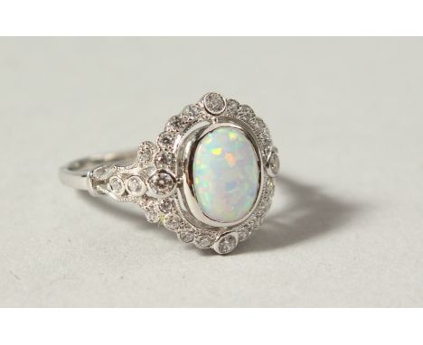 A SILVER, GILSON OPAL AND PASTE DRESS RING.