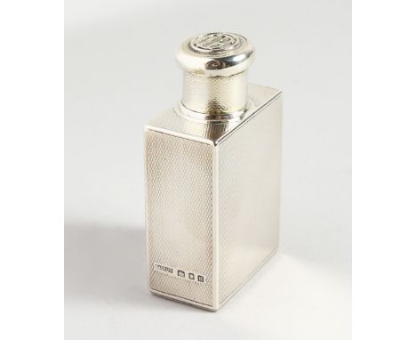 AN ASPREY'S ENGINE TURNED SCENT BOTTLE. London 1908.  2.75ins high.