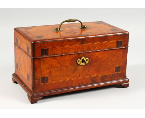A GOOD GEORGE III WALNUT CROSSBANDED CADDY AND COVER, with carrying handle on bracket feet, being used for playing cards. 10.