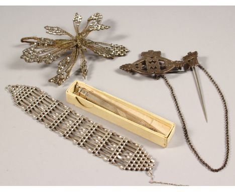 A SILVER BRACELET, FLOWER AND REGIMENTAL CLIP and AN ENGINE TURNED PENCIL.
