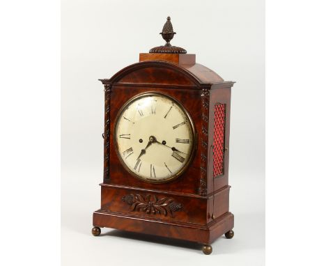 A LATE REGENCY MAHOGANY BRACKET CLOCK, with white dial, brass grilled sides and pineapple finial. 1ft 9ins high.
