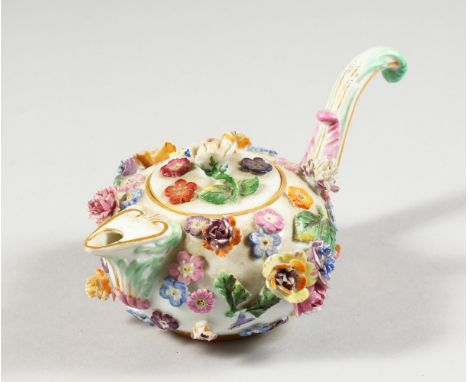 A SMALL 19TH CENTURY MEISSEN FLOWER ENCRUSTED TEAPOT AND COVER with curving handle. Cross swords mark in blue.  6ins long.