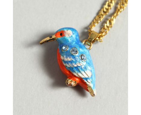 A SMALL ENAMEL KINGFISHER on a chain.
