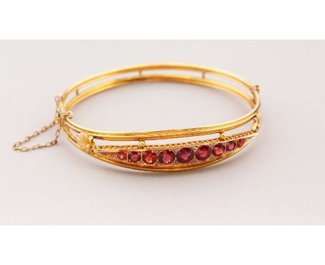 A 9CT GOLD AND RUBY SET BRACELET, 7gms.