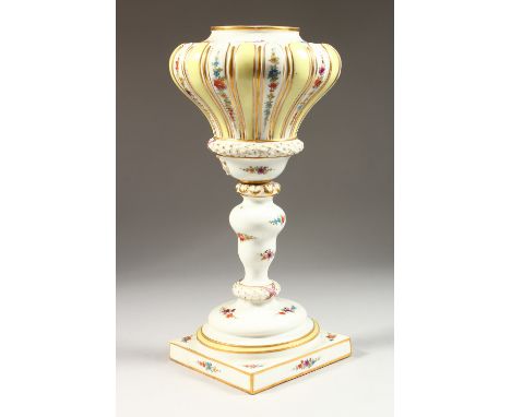 A LARGE 19TH CENTURY MEISSEN PORCELAIN LAMP BASE, sprigged with flowers, on a square base. Cross swords mark in blue.  14ins 