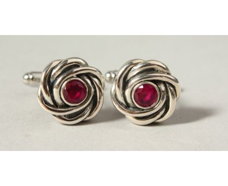 A PAIR OF SILVER RUBY KNOT CUFFLINKS.