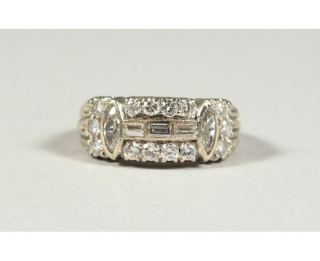 AN 18CT GOLD BAGUETTE DIAMOND RING.