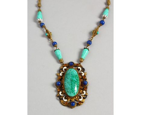 A STONE AND ENAMEL PENDANT AND CHAIN.