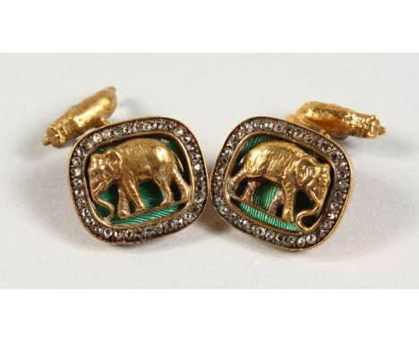 A GOOD PAIR OF RUSSIAN SILVER GILT, ENAMEL AND DIAMOND CUFFLINKS, mounted with elephants and a bear shape toggle to the retai