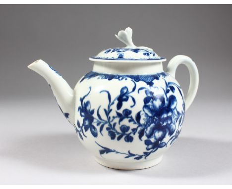 AN 18TH CENTURY WORCESTER TEAPOT AND COVER, painted with trailing flowers in under-glaze blue, crescent mark.