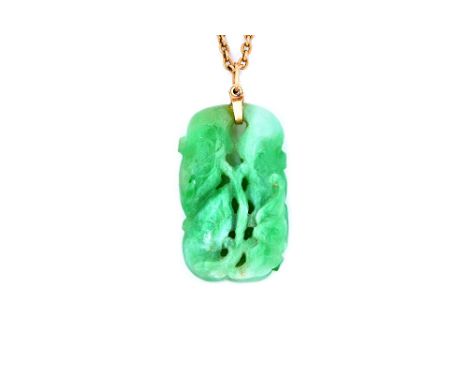 An Asian carved jade pendant, in a pierced foliate design, with a gold oval link neckchain, on a boltring clasp, weight of ch