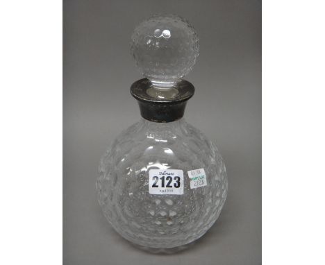 A silver mounted dimpled spherical glass decanter and silver comprising; a twin handled bowl, Birmingham 1936, a napkin ring,