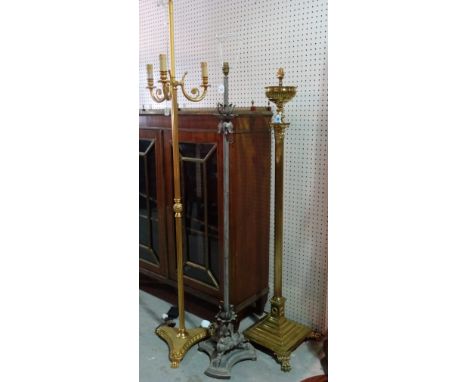 A Victorian style brass standard lamp of Corinthian column form, 140cm high, a modern gilt metal three branch standard lamp, 