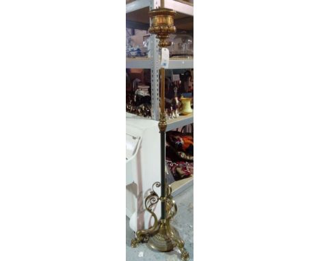 A Victorian gilt and patinated brass adjustable standard lamp (converted), with foliate cast oil reservoir over a fluted colu