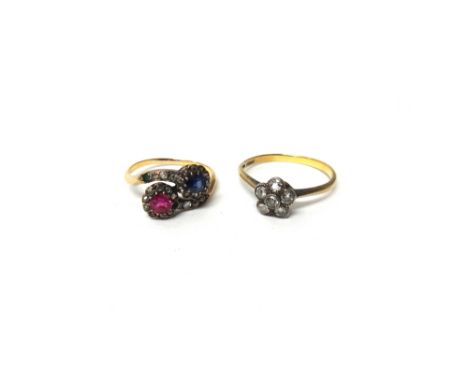 A gold, ruby, sapphire, diamond and gem set ring, in a twin cluster crossover design, ring size K and a half and a gold and d