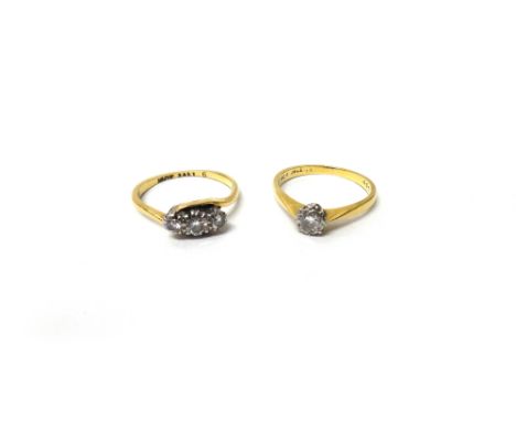 A gold and diamond set single stone ring, mounted with a circular cut diamond, detailed 18 CT, ring size J and a half and a g